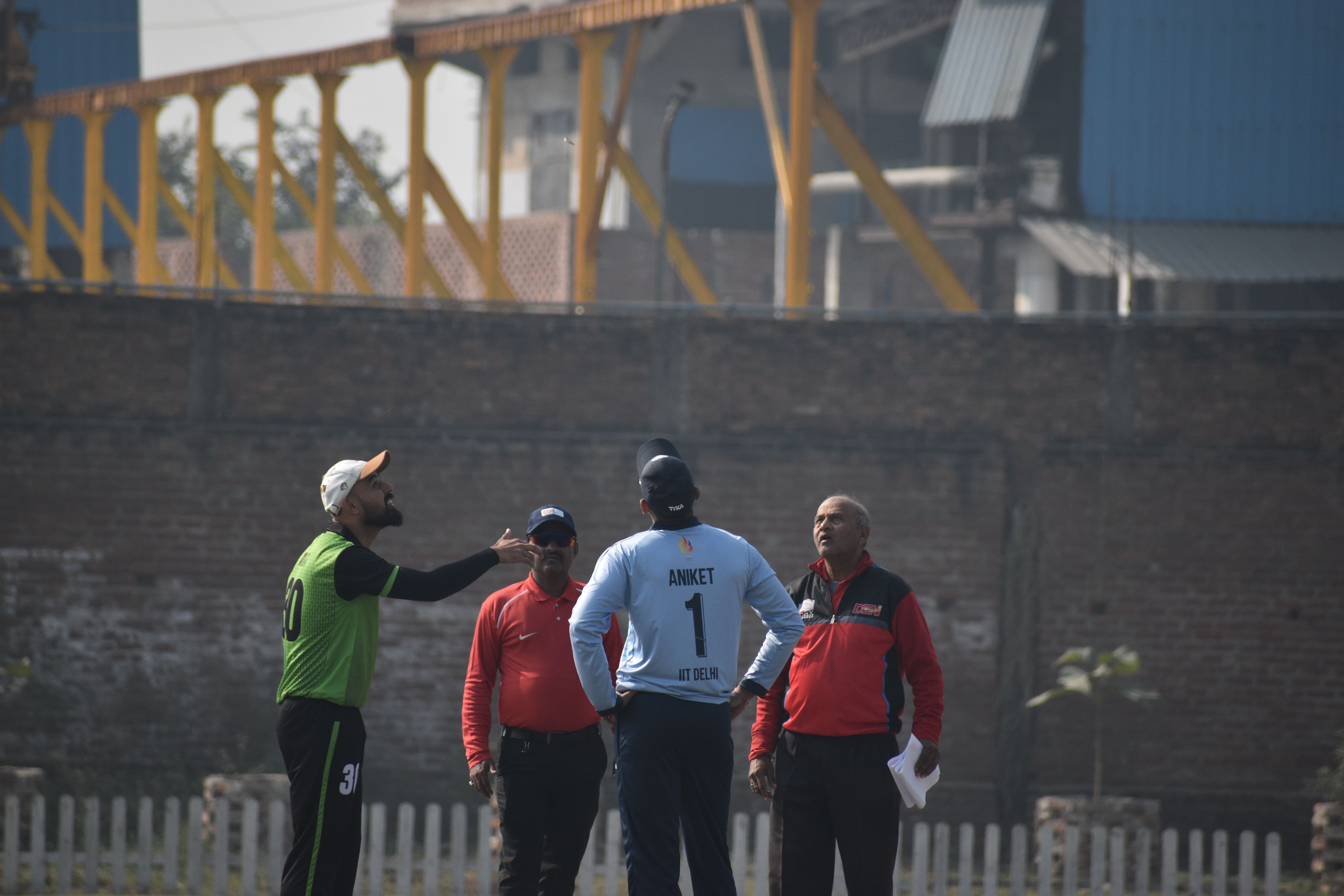 Participating in the toss before a cricket match at the Inter-IIT Sports Meet